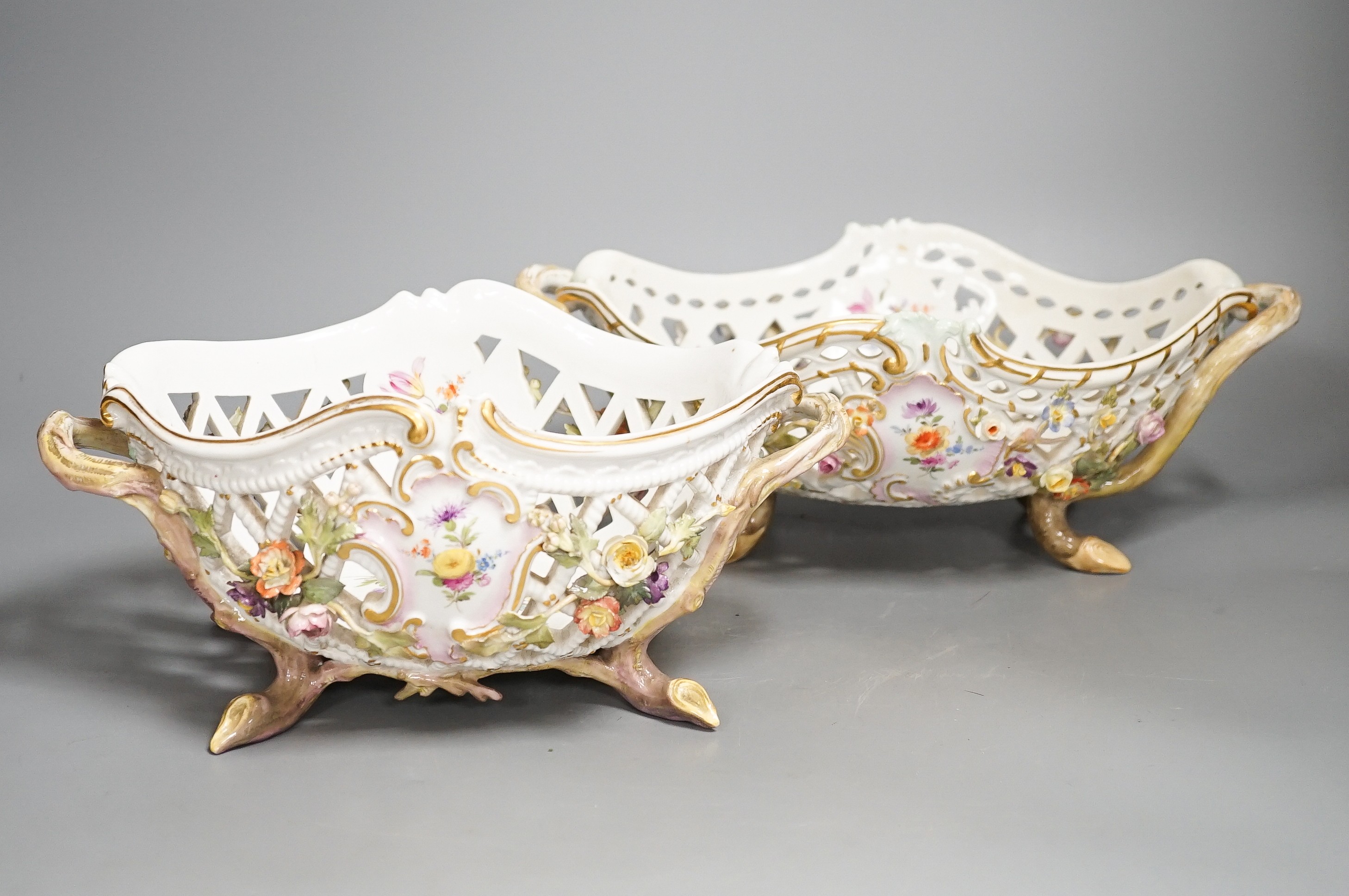 Two similar late 19th century Meissen floral encrusted pierced porcelain bowls 27cm